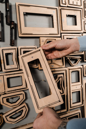 Forms for leather punching press for punch genuine leather. Craftsman tools. Process of creating genuine leather products in factoryの写真素材