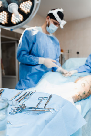 Close-up medical instruments on sterile surgical table in the operating room. Concept of health care...
