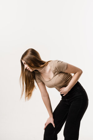 Violation of menstrual cycle in young woman. Algo dysmenorrhea. Menstruation and pain during menstruation of girlの写真素材