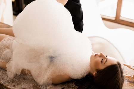 Turkish hammam spa procedure. Foam peeling massage for bodyの写真素材