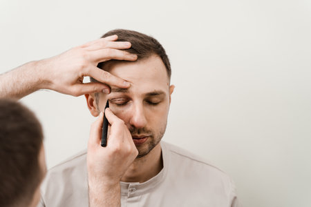 Blepharoplasty for man markup on the face before plastic surgery operation for modifying the eye region in medical clinicの写真素材