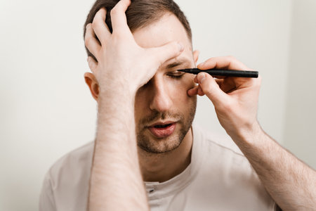 Blepharoplasty for man markup on the face before plastic surgery operation for modifying the eye region in medical clinicの写真素材