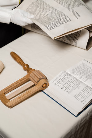 Grogger noisemaker for Purim. Rabbi with jewish hebrew bible is praying for Israel. Purim...