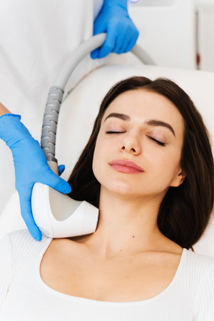 Process of needle-free rf-lifting when you need to tighten your face shape without injections....
