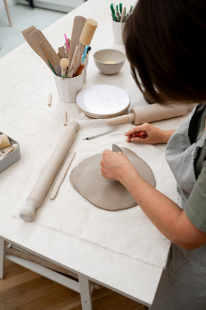 Wedging the clay to eliminate air bubbles. Creating perfect homogenous consistence for ceramics...