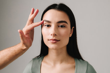 Blepharoplasty to get rid of excess skin from eyelids. Going through eyelids surgery to manage sagging eyebrows, droopy upper lids and eye bagsの写真素材