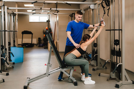 Doing therapeutic gymnastics to return lost mobility. Spine rehabilitation with kinesiotherapy....