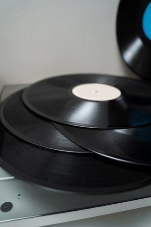 Vintage vinyl cartridges with Hi-Fi sound. Closeup of modern turntable player and vinyl records