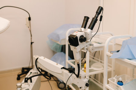 Colposcope for detail examination of disease. Gynecologist does colposcopy procedure to closely...