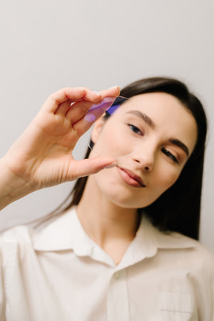 Girl with eyeglass lens, showcasing its clarity, precision, and advanced optical technology. Designed for vision correction, anti-glare protection, and premium eyewear solutionsの写真素材