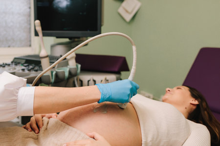 Pregnancy health checkup with ultrasound equipment. Pregnant woman on ultrasound examination at hospitalの写真素材