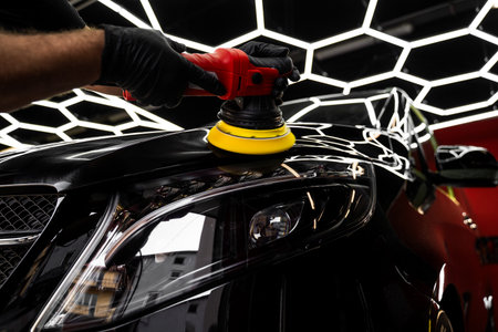 Car detailing polishing restores surface clarity and maximizes gloss. Machine buffing removes imperfections and boosts shine. Automotive polishing improves car surface reflection. Car Paint Polishingの写真素材