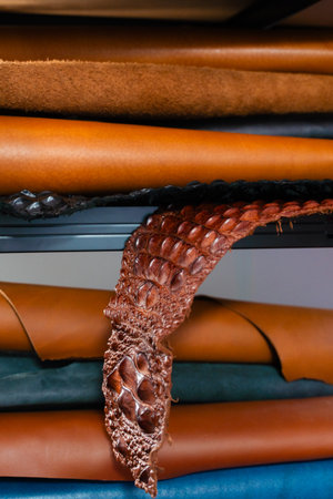 Exotic Leather Material Storage. Leather rolls in multiple tones fill the shelves, offering a range...