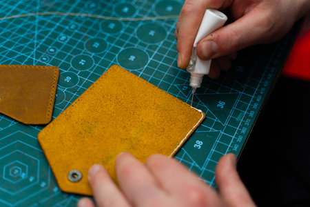 Applying Glue to Leather Edges. Crafting leather goods starts with applying strong adhesive to bond...