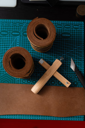 Sharp strap cutter and leather rolls, essential for crafting accurate belt straps. Leather rolls and...