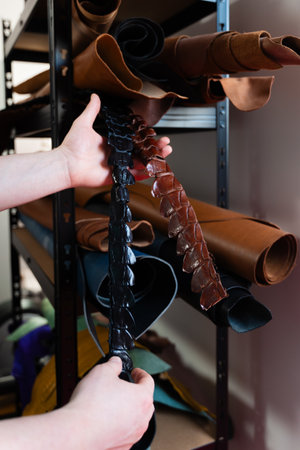 Exotic Leather Material Storage. Leather rolls in multiple tones fill the shelves, offering a range...