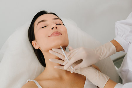 Botulinum toxin chin injection for smoother definition and symmetry. Cosmetic procedure using botulinum toxin to enhance chin and jawline balance. Botulinum toxin chin injection close-upの写真素材