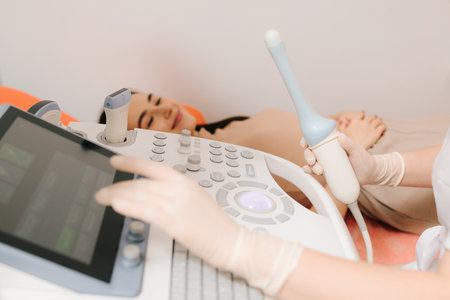 Gynecological transvaginal ultrasound probe used in diagnostics. Gynecological ultrasound probe for women reproductive health diagnostics. Medical ultrasound system for gynecology diagnosticsの写真素材