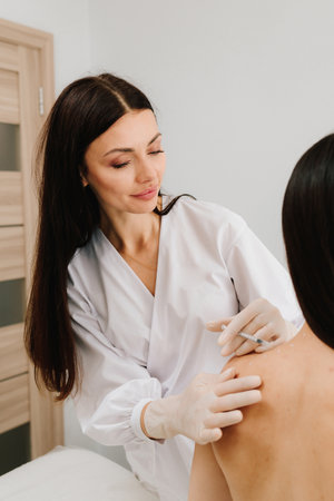 Preparation skin marking for migraine therapy. Remedy of headache problem and pain problems. Injection in marked dotes on back for migraine treatment by doctorの写真素材