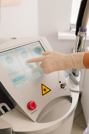 Set laser parameters through a touchscreen interface, preparing equipment for dermatological use....