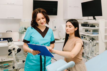 Gynecologist is using colposcopy tools during a gynecological exam. Gynecologist Exam with...