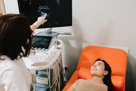 Ultrasound Scan on Monitor. Ultrasound machine shows detailed internal imaging on screen. The ultrasound monitor displays a clear diagnostic image during patient examinationの写真素材