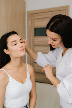 Detailed skin examination before medical procedures such as radio wave removal or resurfacing. Skin consultation before radio wave mole removal and rejuvenation therapyの写真素材