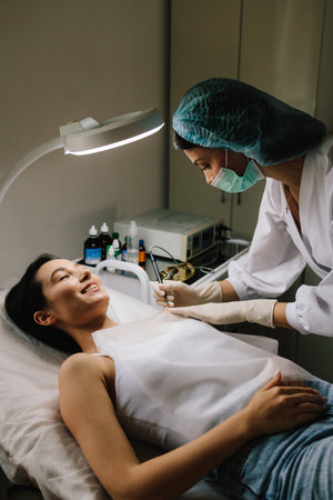 Dermatologist performs precise radio wave mole removal using radiofrequency surgery. Close-up of...