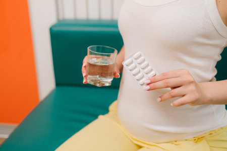 Gynecology checkup embryo health with ultrasound scan in gynecological clinic. Gynecologist prescribes prenatal vitamins and nutritional supplement to pregnant womanの写真素材