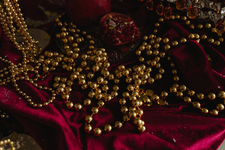 Table decorated for Christmas with glowing candles and glass ornamentsの写真素材