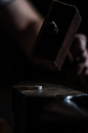 Artisan carefully hammering ring to refine its shape