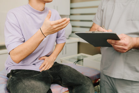 Urology consultation patient discussing urinary symptoms with urologist