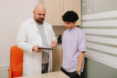 Urologist meeting patient to discuss urinary health and complaintsの写真素材