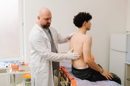 Patient kidney examination with urologist using renal palpationの写真素材