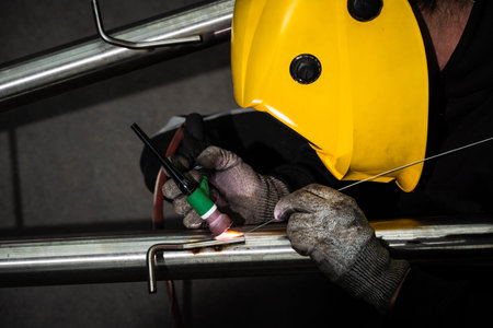 Welder uses argon TIG welding on custom exhaust for precise installation