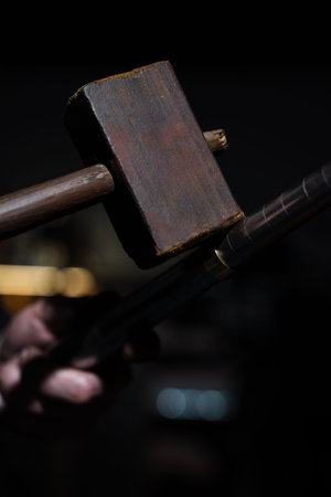 Skilled jeweler hammering ring in production processの写真素材