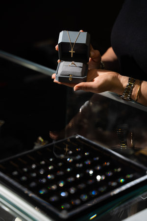 Jewelry box with ring and necklace displayed in luxury retail store