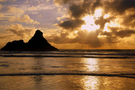 Bright sunset at Karekare beach west aucklandの写真素材