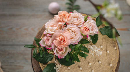 Delicious and beautiful raw cake decorated with tenderness fresh flowers. Concept of romantic mood...
