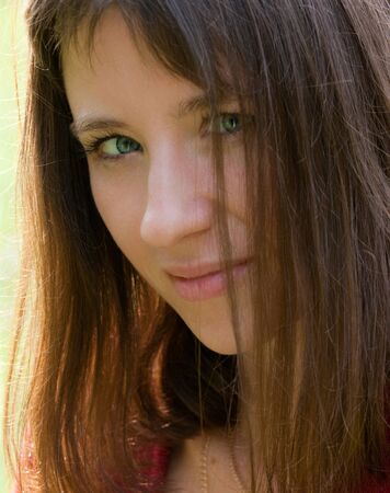 the young brunette with iris walking outdoorsの写真素材