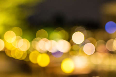 Bokeh abstract texture. Colorful. Defocused background. Blurred bright light. Circular points. blue, green, white, yellow, blackの写真素材