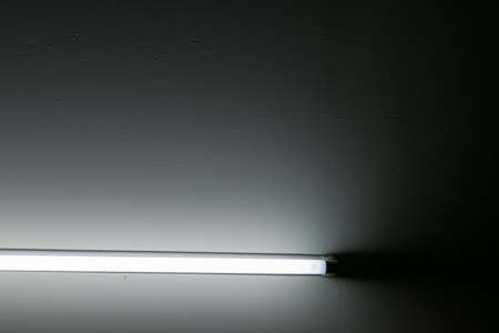 Neon light bulb in the dark. beautiful lightの写真素材