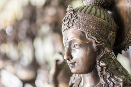 Golden Hindu Goddess Kali closeup on a blurred backgroundの写真素材