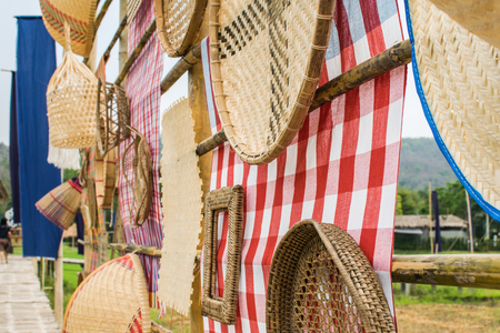 Fabrics and decorative materials from wood And the background is green fields. fabric, pattern, field, decorativeの写真素材