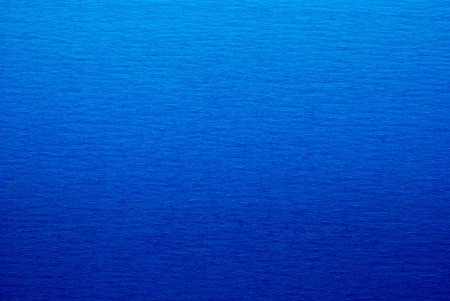 Rumpled blue paper textureの写真素材
