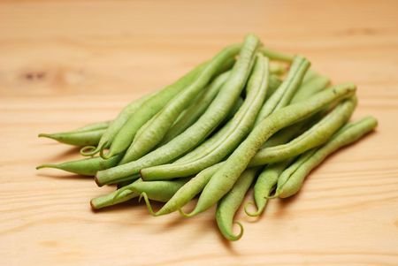 French Beans on wooden surface. Soft focus.の写真素材