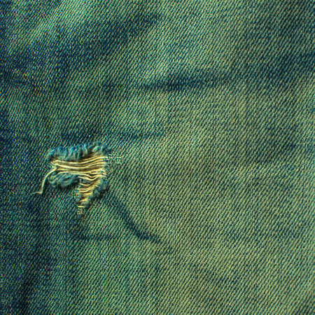 Denim jeans texture or denim jeans background with old torn. Old grunge vintage denim jeans fashion design. Dark edged.の写真素材