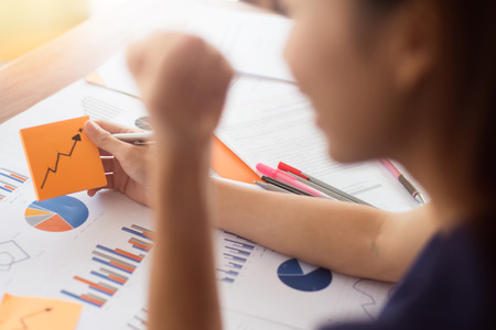 Young entrepreneur happy and celebration for achievement success mission at home office.Conceptual for small businesses starting own company and online marketing.の写真素材