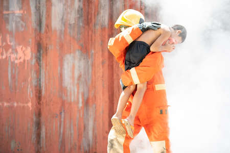 Firefighters training activity, Team practice to fight fire in emergency situation. A fireman run...