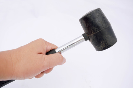 Holding a hammer.